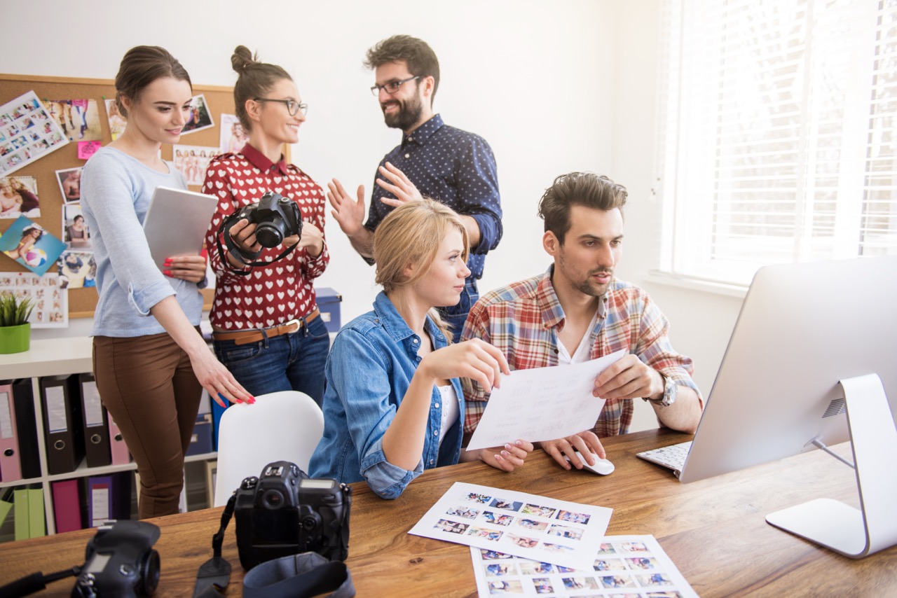 Creative marketing team working on branding and photography project in office